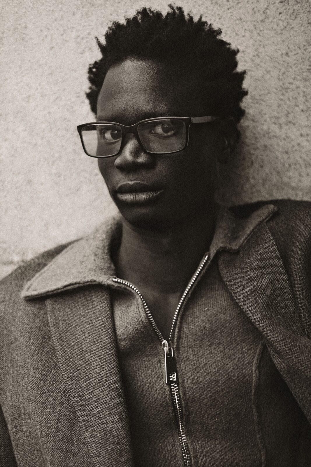 Sepia portrait of a young man in glasses — Rosario Nandjui for ZELZAL