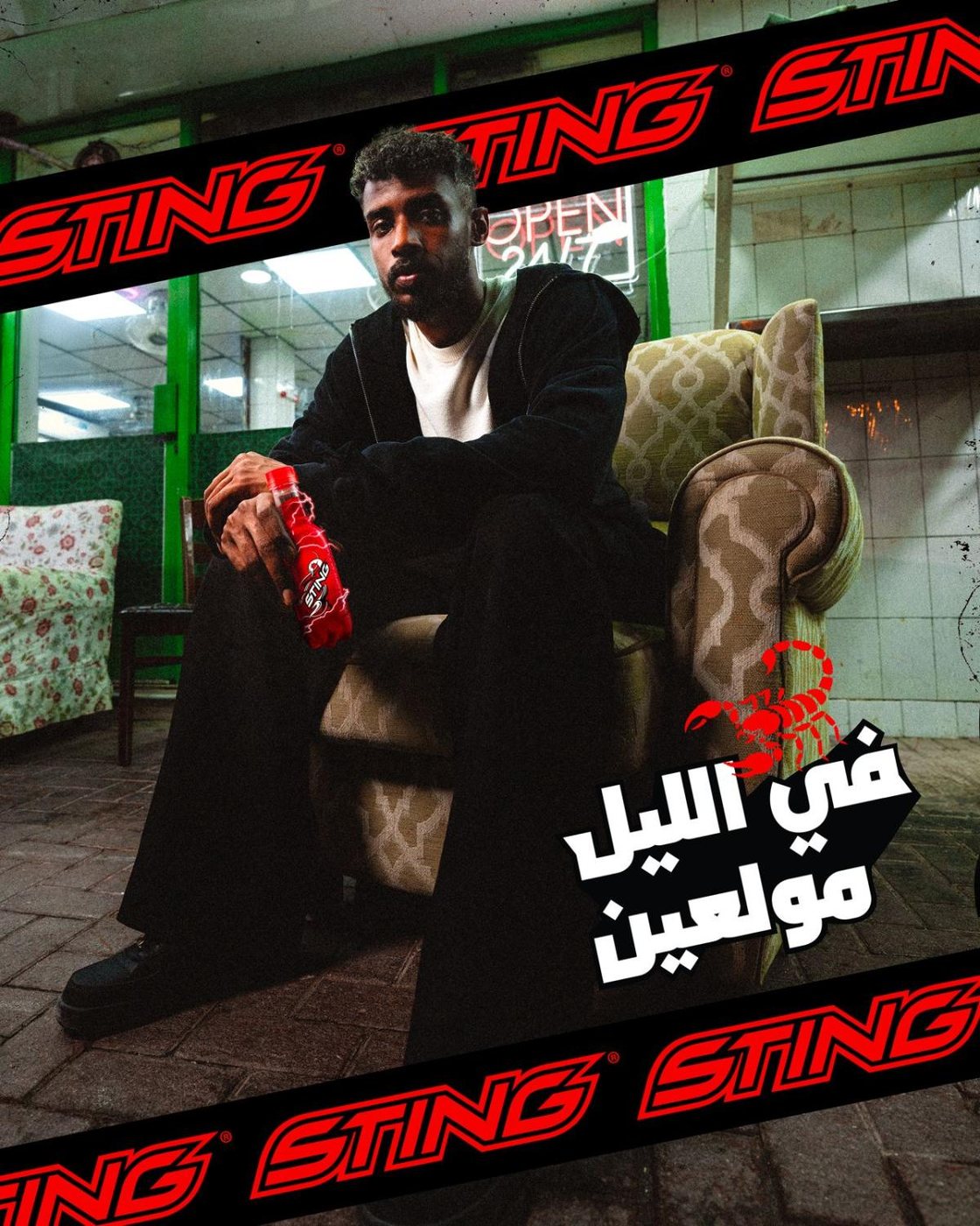 Sting campaign: talent seated in an armchair holding a can of Sting, Arabic campaign line