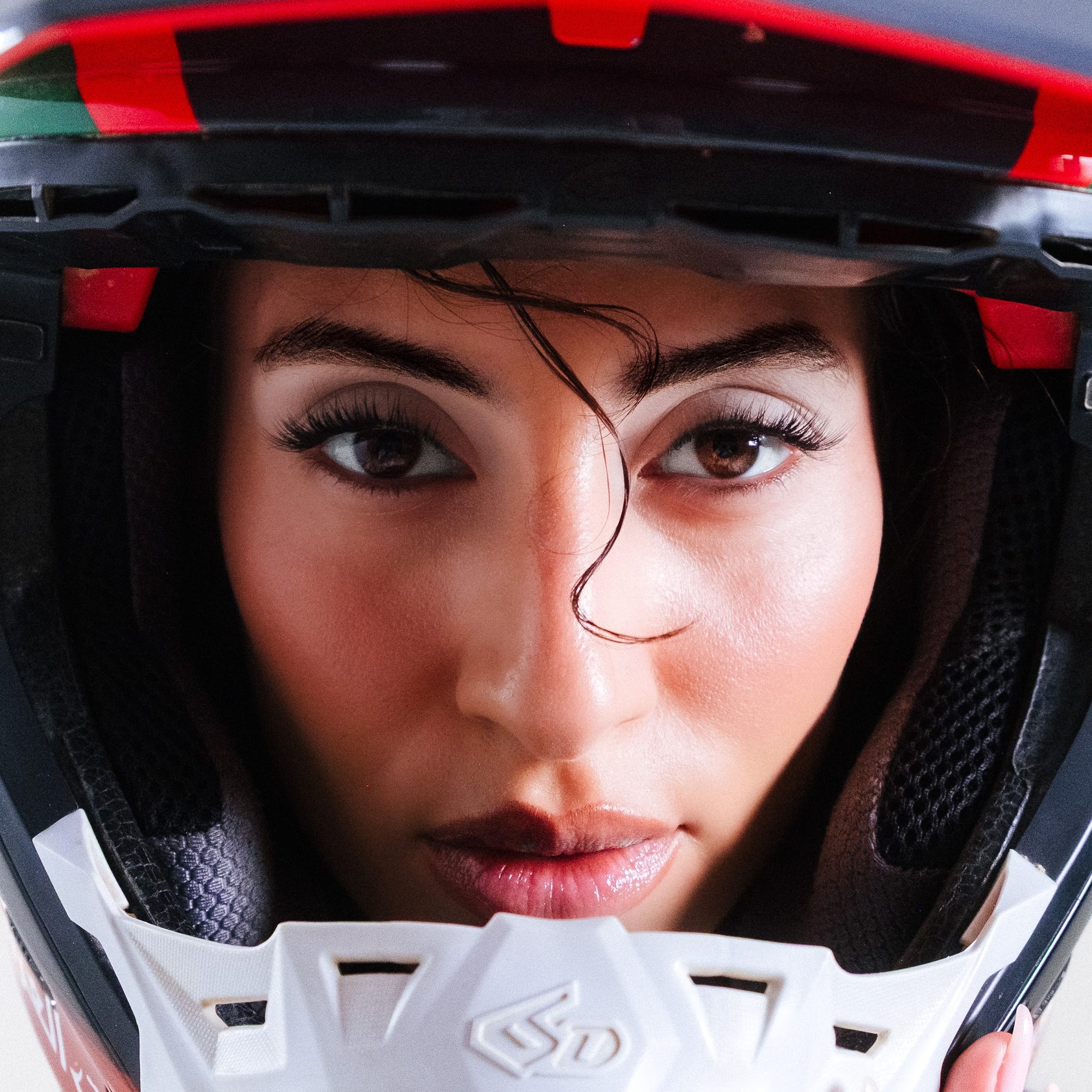ARMOR: woman in an open motocross helmet